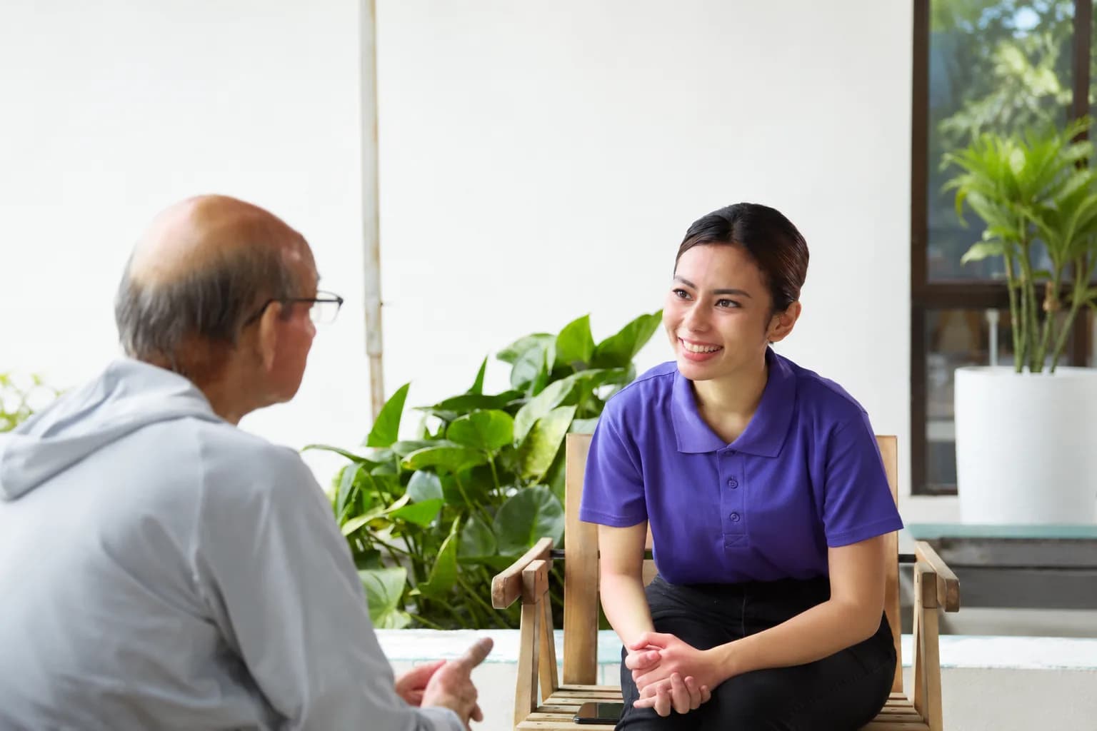 Care professional discussing support with a family at home